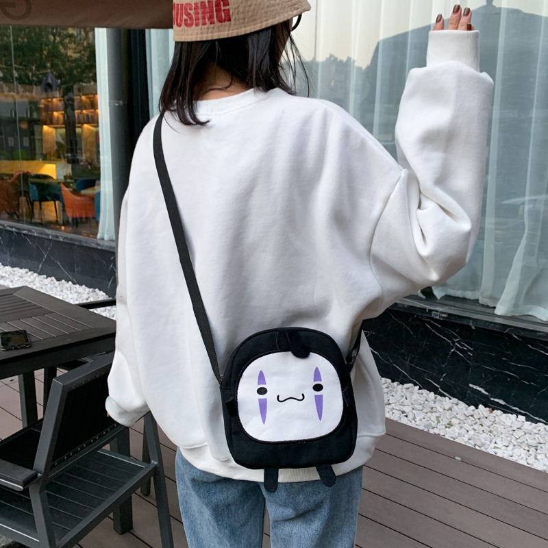 ms搞怪潮包包女夏季新款日系原宿帆布無臉男個性單肩斜挎包包-細節圖4