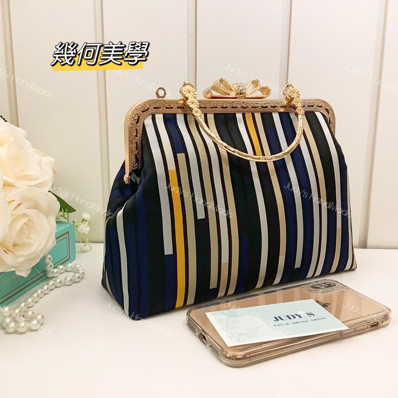 《Judy’s 小鋪》幾何美學 蝴蝶結口金包 附花形提手 現代風格 時尚設計感 送錬條現貨 手機包手提包斜肩包-細節圖3
