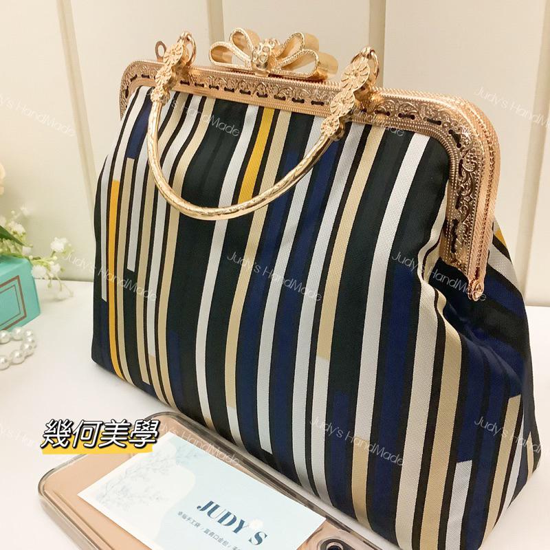 《Judy’s 小鋪》幾何美學 蝴蝶結口金包 附花形提手 現代風格 時尚設計感 送錬條現貨 手機包手提包斜肩包-細節圖4