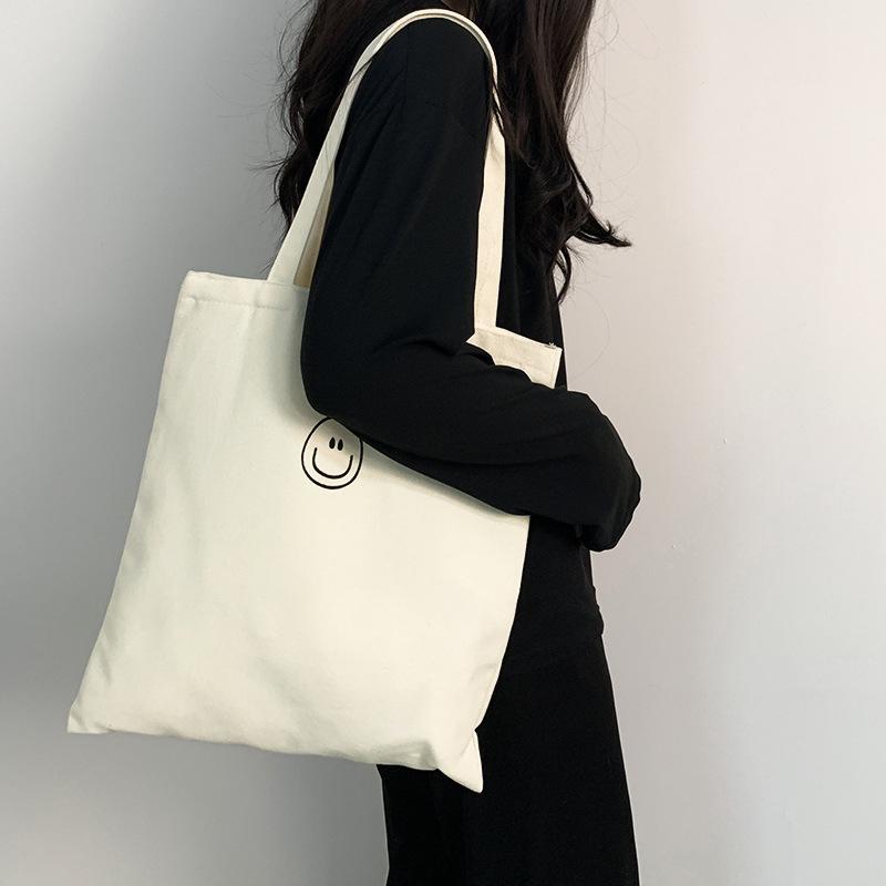 🎀【現貨+發票】韓版新款ins原宿微笑簡約可愛笑臉拉鍊帆布袋帆布包購物包肩背包單肩包側背包手提包手提袋購物袋文藝百搭-細節圖2