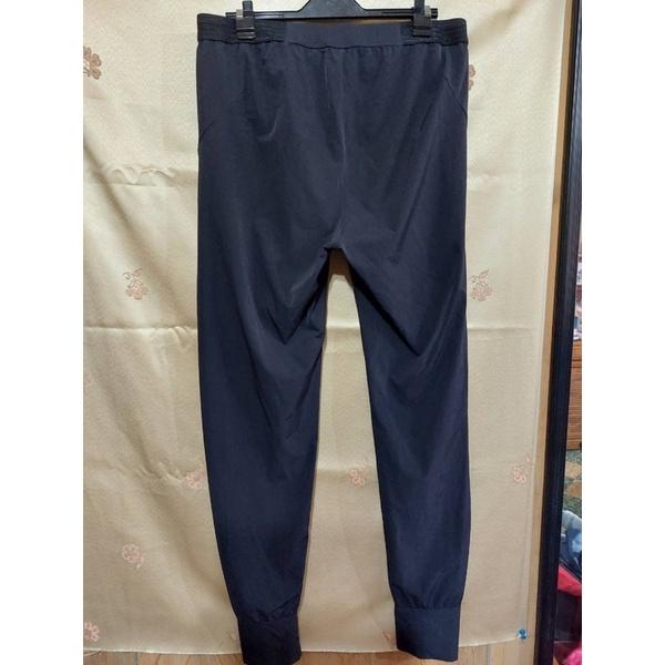 Nike 防風縮口長褲-細節圖2