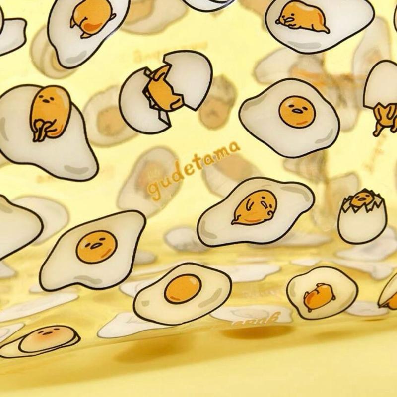 正版聯名 蛋黃哥 Gudetama 黃色卡通滿版圖案透明化妝包 化妝收納包-細節圖4