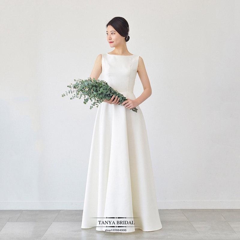 旗艦店緞面輕婚紗2023新款韓式新娘一字肩白色簡約齊地森系婚禮旅拍春季-細節圖2