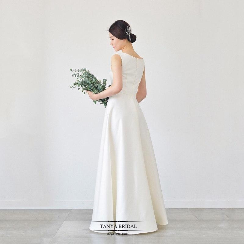 旗艦店緞面輕婚紗2023新款韓式新娘一字肩白色簡約齊地森系婚禮旅拍春季-細節圖3