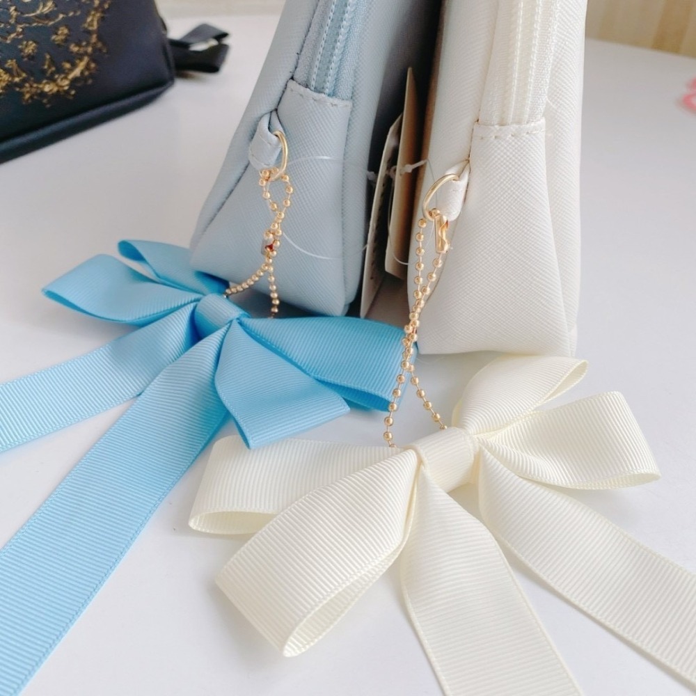 🎈彩虹尾巴🎈三麗鷗緞帶蝴蝶結皮質化妝包 KITTY 大耳狗 美樂蒂 酷洛米 小物包 收納小包-細節圖3