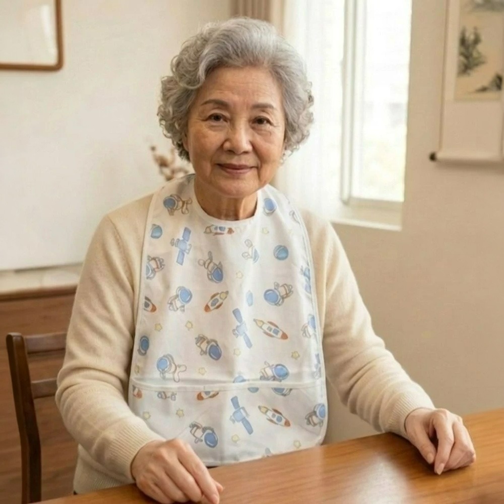 凱美棉業【台灣設計】成人純棉紗布防水圍兜 雙面吸水防漏食物袋 長輩銀髮/居家照護進食圍裙 頂級多層結構 療癒系印花-細節圖2