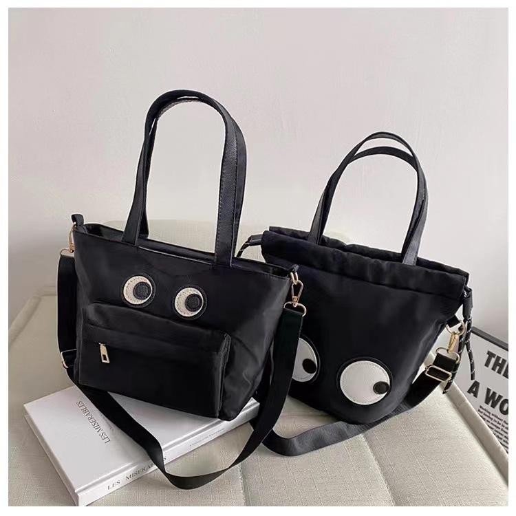 WDF.CO現貨│2024新款韓國大眼睛托特包│抽繩包 │黑色2款│防潑水│有拉鍊 │斜背包｜大容量｜通勤包｜外出包-細節圖2