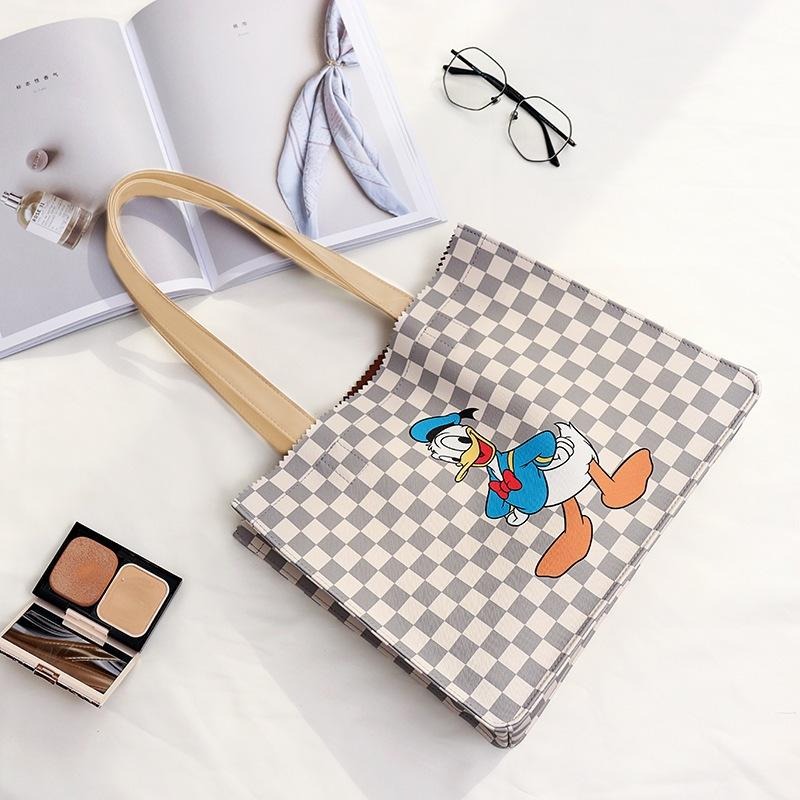 正版✨唐老鴨皮革托特包手提袋 迪士尼手提袋托特包 十字紋提袋 PVC防水表面（平行輸入代購）-細節圖3