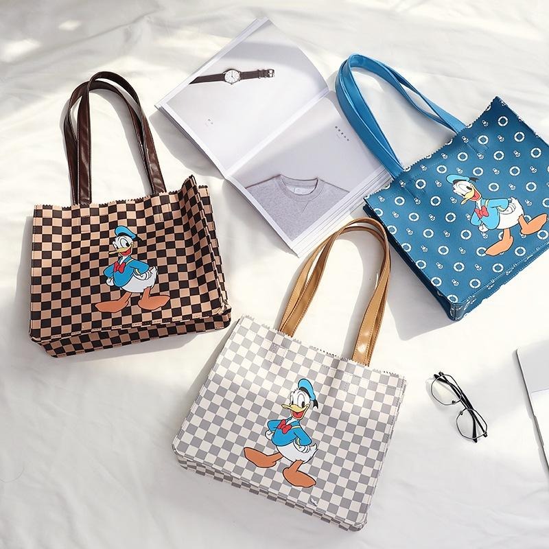 正版✨唐老鴨托特包 皮革托特包 人造皮革 迪士尼大容量購物袋單肩包 PVC防水表面（平行輸入代購）-細節圖2