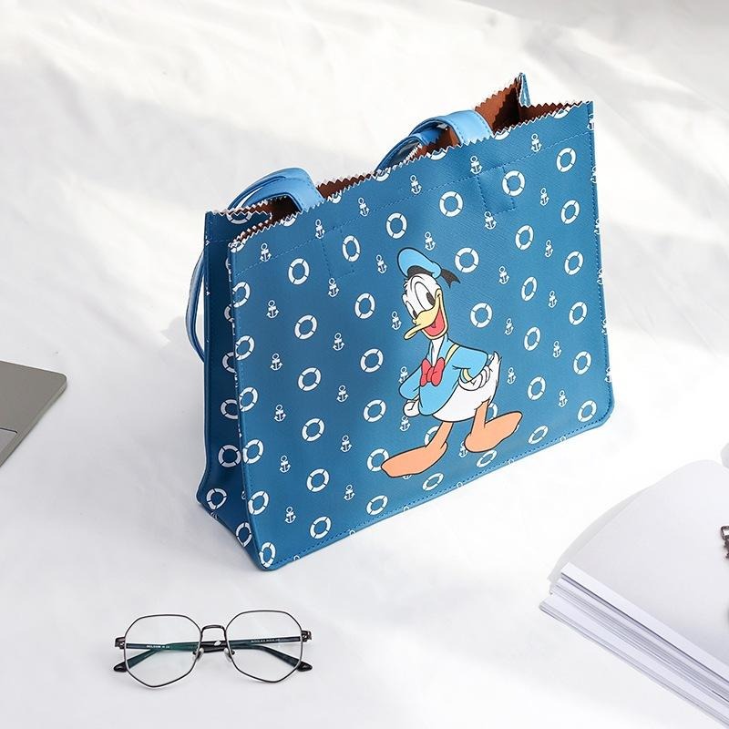 正版✨唐老鴨托特包 皮革托特包 人造皮革 迪士尼大容量購物袋單肩包 PVC防水表面（平行輸入代購）-細節圖4