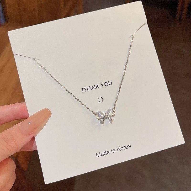 👗台灣現貨🌿輕奢小眾貓眼石幻彩蝴蝶結項鍊 女ins簡約甜美鈦鋼鎖骨鏈【Q74】-細節圖8