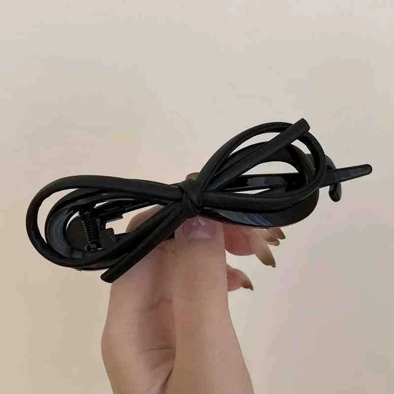 ✨台灣現貨🌿氣質皮質蝴蝶結扭扭夾 一字夾 8字髮夾 甜酷豹紋盤髮馬尾夾【N132】-細節圖5